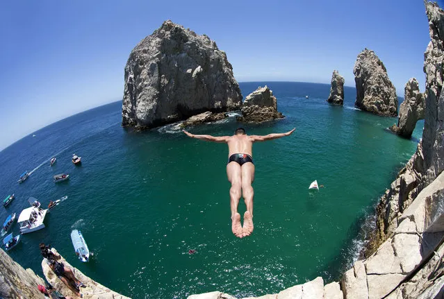 Jonathan Paredes of Mexico dives from the rocks of the Arch of Cabo San Lucas, Mexico during a training session ahead to the 2017 Red Bull Cliff Diving World Series on May 17, 2017. (Photo by Red Bull Content Pool/SIPA/Rex Features/Shutterstock)