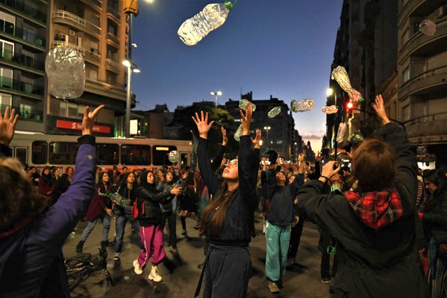 People take part in a protest called by Uruguay's Central Union (PIT-CNT) in “defense of water” against the handling of the national authorities with respect to the management of the shortage of drinking water reserves in Montevideo on May 31, 2023. The state-owned company Obras Sanitarias del Estado (OSE) decided to increase for the second time the levels of salinity in the water at the beginning of May to make the reserves last even longer due to the persistent drought that is affecting Uruguay. (Photo by Eitan Abramovich/AFP Photo)