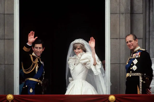Prince Charles And Princess Diana Waving From  The Balcony Of Buckingham Palace on July 29, 1981.  They Are Accompanied By Prince Philip. The Princess Is Wearing A Dress Designed By David And Elizabeth Emanuel. (Photo by Tim Graham/Getty Images)