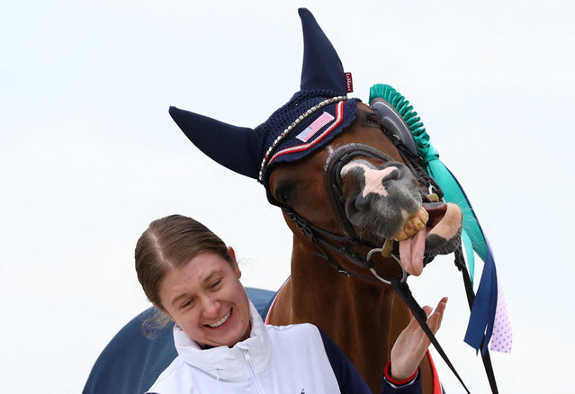 Gold medallist Fiona Howard of United States' horse Diamond Dunes during the medal ceremony in individual freestyle event grade II in Versailles, France on September 7, 2024. (Photo by Jeremy Lee/Reuters)