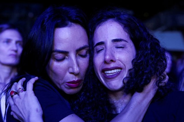 Women embrace in the crowd at an event to mark the anniversary of the October 7 Hamas attacks on Israel, in Central Park, New York City on October 8, 2024. (Photo by Kent J Edwards/Reuters)