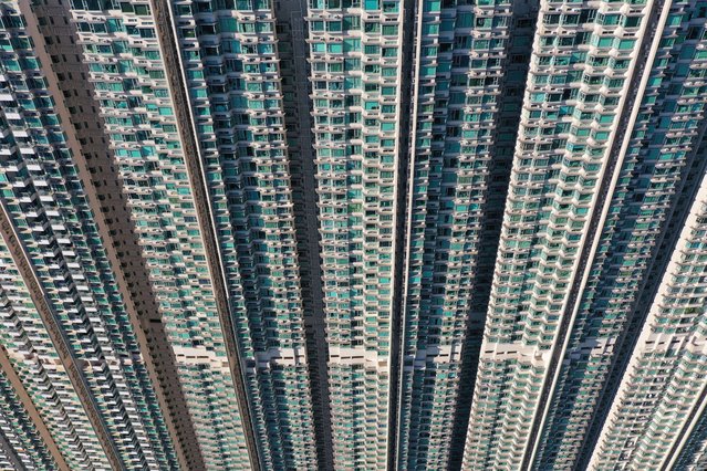 This aerial photo taken on October 14, 2024 shows apartment blocks in Tung Chung on Lantau Island in Hong Kong. (Photo by Peter Parks/AFP Photo)