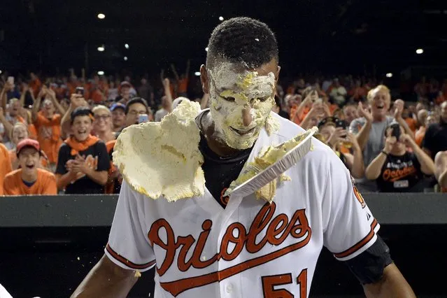 Aug 19, 2015; Baltimore, MD, USA; Baltimore Orioles center fielder Adam Jones (not pictured) pies left fielder Henry Urrutia (51) after his walk off home run during the ninth inning against the New York Mets at Oriole Park at Camden Yards. Baltimore Orioles defeated New York Mets 5-4. (Photo by Tommy Gilligan/USA TODAY Sports)