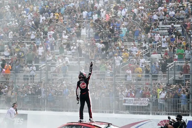 Christopher Bell celebrates after winning a NASCAR Cup Series auto race at the New Hampshire Motor Speedway, Sunday, July 17, 2022, in Loudon, N.H. (Photo by Charles Krupa/AP Photo)