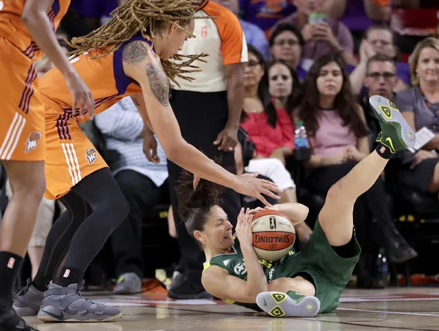 Seattle Storm guard Sue Bird (10) and Phoenix Mercury center Brittney Griner vie for the ball during the second half of a single-game WNBA basketball playoff matchup, Wednesday, September 6, 2017, in Tempe, Ariz. Phoenix won 79-69. (Photo by Matt York/AP Photo)