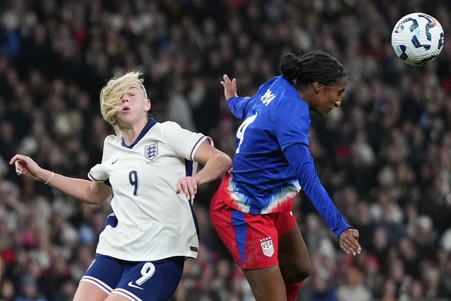 England's Alessia Russo, left, and United States' Naomi Girma challenge for the ball during the International friendly women soccer match between England and United States at Wembley stadium in London, Saturday, November 30, 2024. (Photo by Kirsty Wigglesworth/AP Photo)