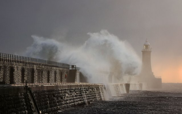 Waves crash over the Tynemouth pier lighthouse at the mouth of the river Tyne in North East England on Thursday, October 10, 2024. (Photo by Owen Humphreys/PA Wire)