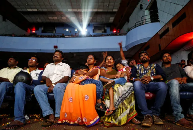 Cinemagoers watch Tamil film “Kabali” inside a movie theatre in Mumbai, India, July 22, 2016. (Photo by Danish Siddiqui/Reuters)