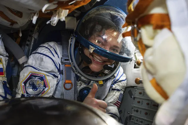 In this handout photo released by Gagarin Cosmonaut Training Centre (GCTC), Roscosmos space agency, U.S. astronaut Jessica Meir sits in the capsule shortly after the landing of the Russian Soyuz MS-15 space capsule near Kazakh town of Dzhezkazgan, Kazakhstan, Friday, April 17, 2020. An International Space Station crew has landed safely after more than 200 days in space. The Soyuz capsule carrying NASA astronauts Andrew Morgan, Jessica Meir and Russian space agency Roscosmos' Oleg Skripochka touched down on Friday on the steppes of Kazakhstan. (Photo by Andrey Shelepin, Gagarin Cosmonaut Training Centre (GCTC), Roscosmos space agency, via AP Photo)