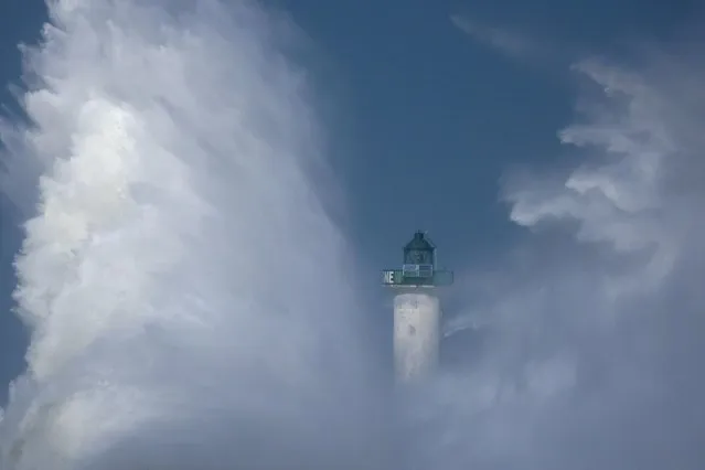 Waves crash against a lighthouse during Storm Franklin at Boulogne-sur-Mer, February 21, 2022. (Photo by Pascal Rossignol/Reuters)