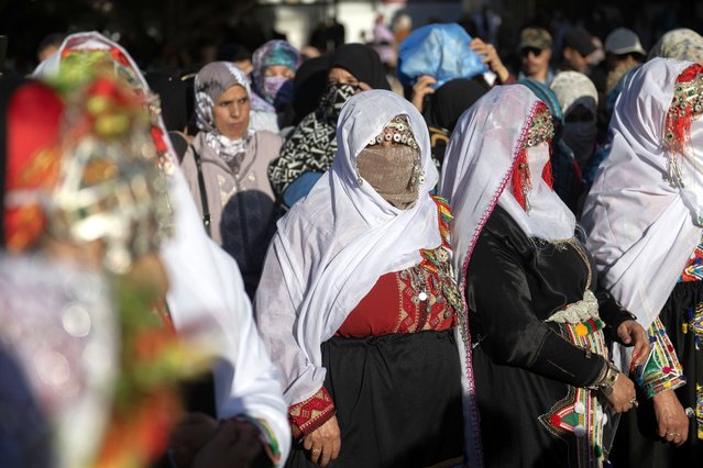 Berber women and girls wearing traditional clothes attend a celebration on the occasion of the celebration of the Amazigh New Year 2975, in Rabat, Morocco, 14 January 2025. Amazighs are an ethnic group belonging to the Berber tribes. (Photo by Jalal Morchidi/EPA)