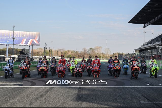 MotoGP riders pose for a group photo at the Buriram International Circuit in Buriram on February 27, 2025, ahead of the Thailand MotoGP Grand Prix. (Photo by Lillian Suwanrumpha/AFP Photo)