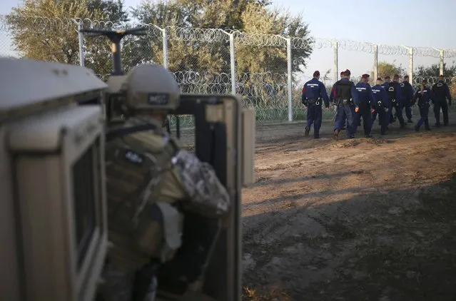 Hungarian soldiers arrive at the border near Roszke, Hungary September 14, 2015. (Photo by Dado Ruvic/Reuters)