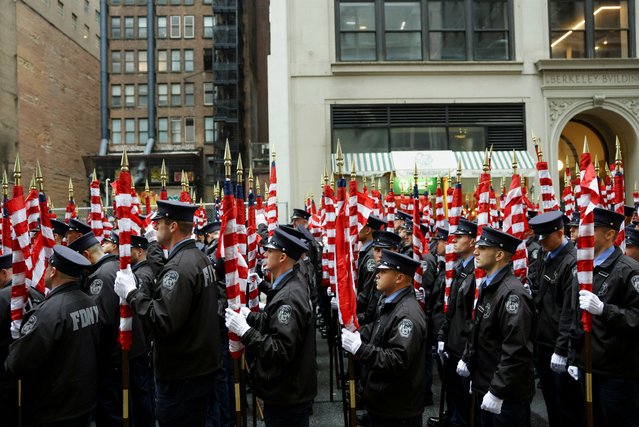 New York City Fire Department members hold flags on the day of the 264th New York City St. Patrick's Day parade in Manhattan in New York City, New York, on March 17, 2025. (Photo by Jeenah Moon/Reuters)