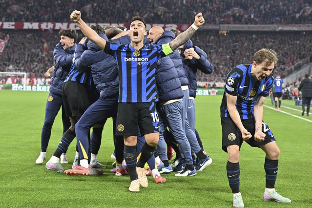 Inter's Lautaro Martinez, center, and Nicolo Barella, right, celebrate after the Champions League quarterfinals first leg soccer match between FC Bayern Munich and Inter Milan, at the Allianz Arena in Munich, Germany, Tuesday, April 8, 2025. (Photo by Peter Kneffel/dpa via AP Photo)