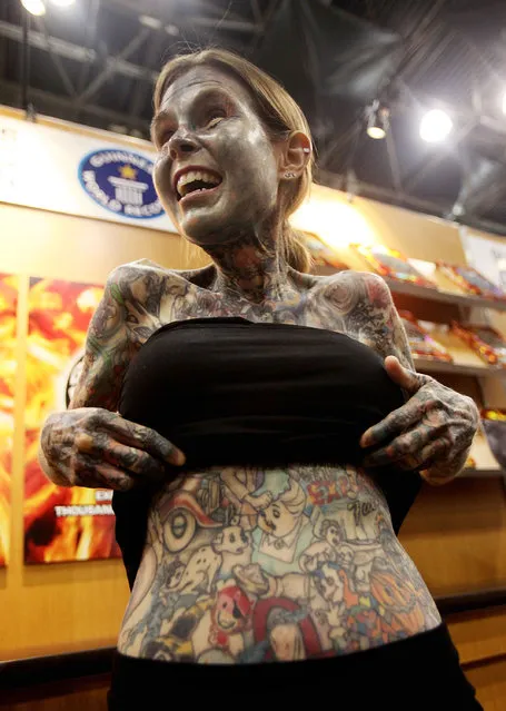 Guinness World Record-holder Julia Gnuse, the “most tattooed woman” in the world, poses at BookExpo America at the Javits Center May 26, 2010 in New York City. Gnuse has tattoos covering 95 percent of her body and has used the same artist for every design. (Photo by Mario Tama)