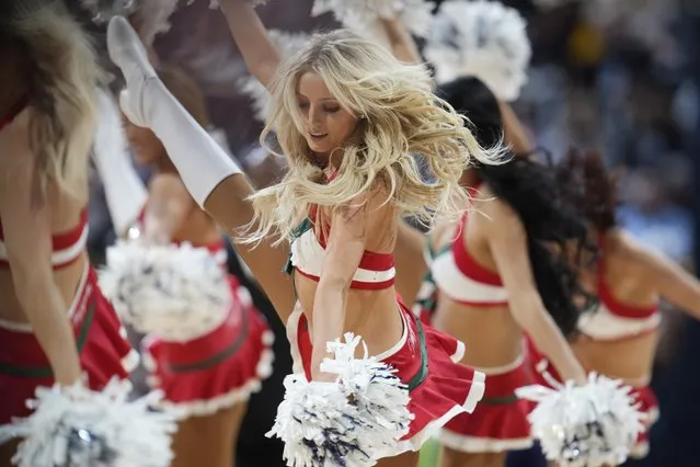 Denver Nuggets dance team performs in the first half of an NBA basketball game against the Charlotte Hornets Sunday, December 18, 2022, in Denver. (Photo by David Zalubowski/AP Photo)
