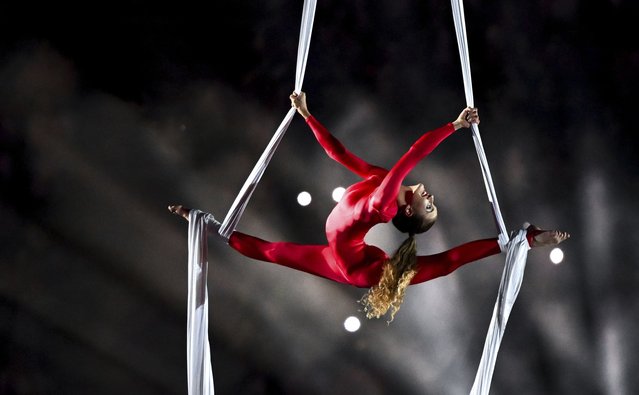 A performer participants in the stadium gala at the International German Gymnastics Festival in the Red Bull Arena in Leipzig, Germany, Saturday, May 31, 2025. (Photo by Hendrik Schmidt/dpa via AP Photo)