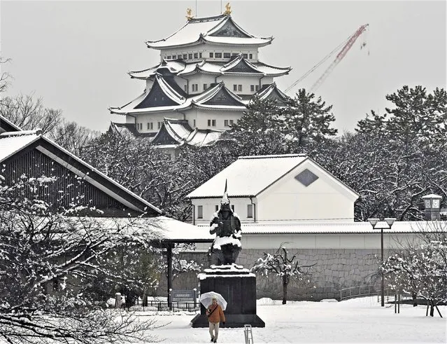 Nagoya castle is covered with snow on a winter day in Nagoya, Aichi prefecture, central Japan, on December 24, 2022. (Photo by Kyodo News via AP Photo)