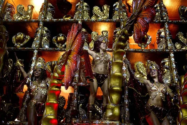 Performers from the Beija Flor samba school parade on a float at the Sambadrome in Rio de Janeiro. (Photo by Felipe Dana/Associated Press)