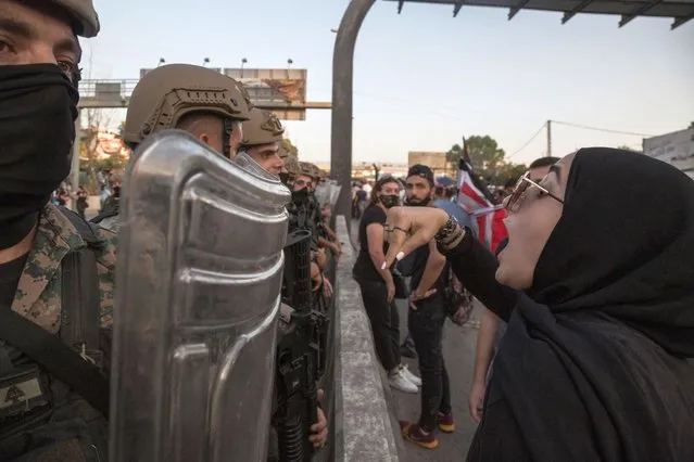 Anti-government protesters argue with security forces during a march toward the Presidential Palace, on September 12, 2020 in Baabda, Beirut, Lebanon. (Photo by Sam Tarling/Getty Images)