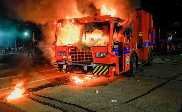 A city garbage truck burns during a second night of unrest in the wake of the shooting of Jacob Blake by police officers, in Kenosha, Wisconsin, USA, 24 August 2020. According to media reports Jacob Blake, a black man, was shot by a Kenosha police officer or officers responding to a domestic distubance call on 23 August, setting off protests and unrest. Blake was taken by air ambulance to a Milwaukee, Wisconsin hospital and protests started after a video of the incident was posted on social media. (Photo by Tannen Maury/EPA/EFE)