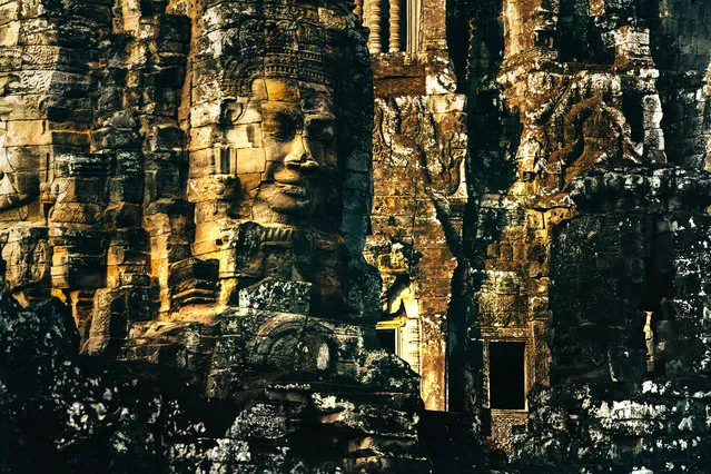 Bayon temple is known for its many  smiling faces. (Photo by Alex Teuscher/Caters News)
