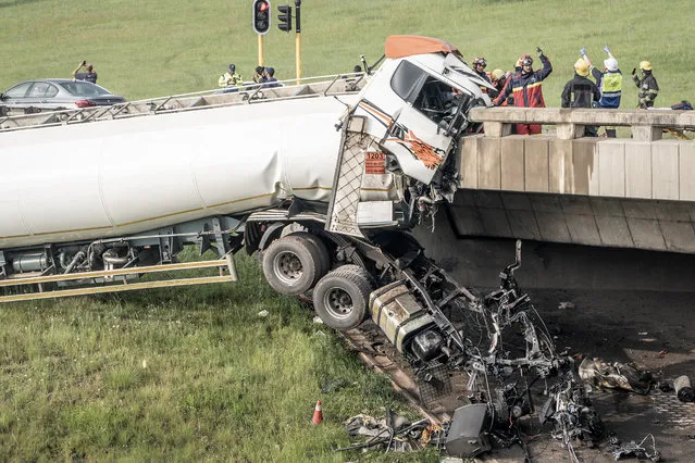 Paramedics and emergency service personnel work on the scene of a diesel tanker crash on the N12 highway in Johannesburg on January 7, 2023. (Photo by AFP Photo/Stringer)