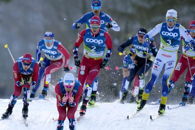 Norway's Johannes Hoesflot Klaebo, third left, competes during the Men's Skiathlon 15km Classic and 15km Free at the Nordic World Ski Championships in Planica, Slovenia, Friday, February 24, 2023. (Photo by Matthias Schrader/AP Photo)