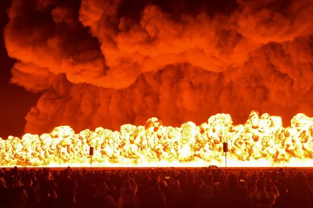 The “Wall of Fire” pyrotechnics display concludes the first public day of the Australian International Airshow Aerospace and Defence Expo at Avalon Airport in Geelong on March 3, 2023. (Photo by Paul Crock/AFP Photo)
