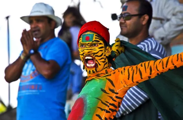 A Bangladesh cricket fan reacts on the second day of the second test match against Zimbabwe in Harare, on April 26, 2013. (Photo by Tsvangirayi Mukwazhi/Associated Press)