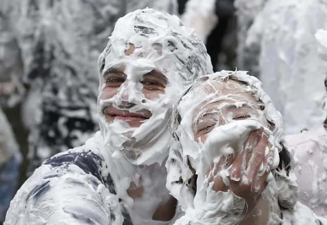 Students from St Andrews University are covered in foam as they take part in the traditional “Raisin Weekend” in the Lower College Lawn, at St Andrews in Scotland, Britain October 17, 2016. (Photo by Russell Cheyne/Reuters)