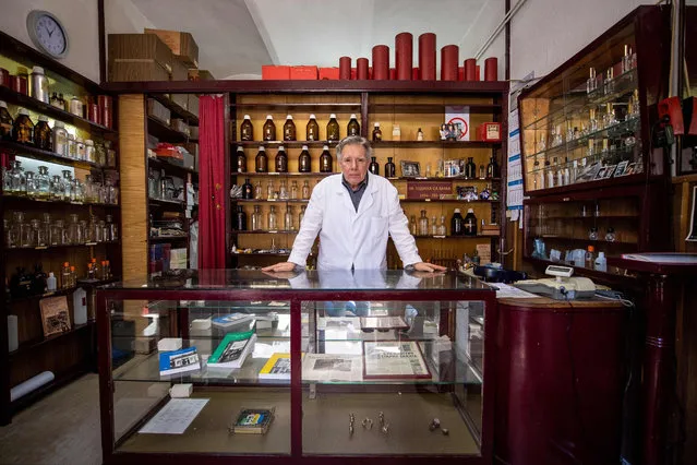 Nenan Jovanov, 70, poses for a picture in his 64 years old perfume shop in Belgrade on April 19, 2018. Nenad literally grow up in this “time capsule” shop as third generation of a family business. Nenad says, “There used to be 23 perfume shops of this kind in Belgrade; now I am the only one left”. (Photo by Andrej Isakovic/AFP Photo)