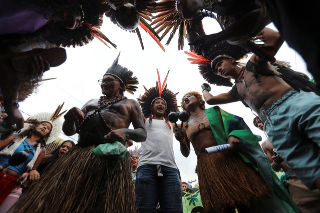 Indigenous demonstrators gather outside the venue hosting the UN Climate Change Conference (COP30), in Belem, Brazil, on November 11, 2025. (Photo by Anderson Coelho/Reuters)