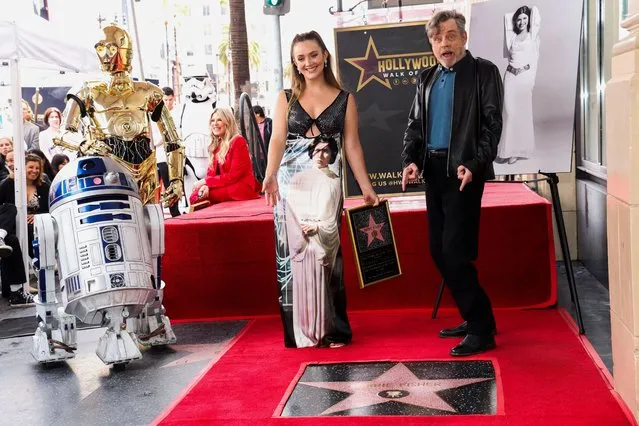 Billie Lourd and Mark Hamill pose along Star Wars characters C-3PO and R2-D2 next to the star of actor Carrie Fisher during its posthumous unveiling ceremony on the Hollywood Walk of Fame in Los Angeles, California, U.S., May 4, 2023. (Photo by Mario Anzuoni/Reuters)