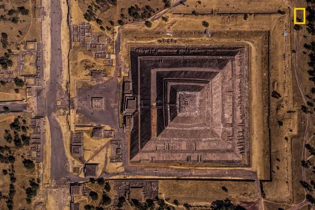 “Geometry of the Sun”. “Teotihuacan means “the place where the gods were created,” and that’s the feeling you get when you visit this archaeological site in Mexico. This pyramid, the third-largest on Earth, was dedicated to the sun god, and its geometrical perfection can only inspire admiration for the civilization that built it. The grandeur of this behemoth is even greater compared with those tiny dots of humanity in the frame. Seemingly insignificant, but in the end also the makers of this wonder”. (Photo by Enrico Pescantini/National Geographic Travel Photographer of the Year Contest)