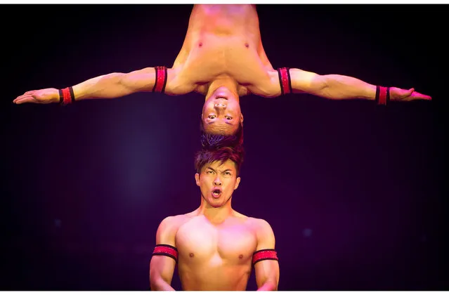 Artists perform during a show of the UniverSoul Circus at National Harbor, Maryland on June 16, 2013. UniverSoul is the only African-American owned circus founded in Atlanta by concert and theater promoter, Cedric Walker. The show includes artists from the United States, Trinidad and Tobago, Colombia, France, Vietnam, South Africa, Russia, Brazil and West Africa. (Photo by Mladen Antonov/AFP Photo)