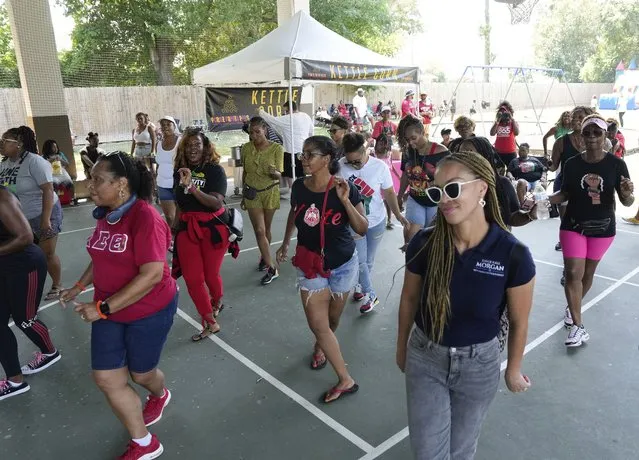 People dance at a festival after Katy's first Juneteenth parade, Monday, June 19, 2023, at Woodsland Park in Katy, Texas. (Photo by Yi-Chin Lee/Houston Chronicle via AP Photo)