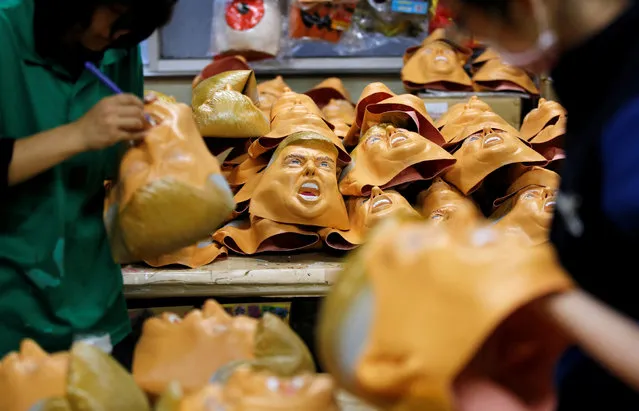Workers of Ogawa Studios, a mask making company, give the final touches to masks depicting U.S. President-elect Donald Trump at its studio in Saitama, Japan, November 21, 2016. (Photo by Toru Hanai/Reuters)