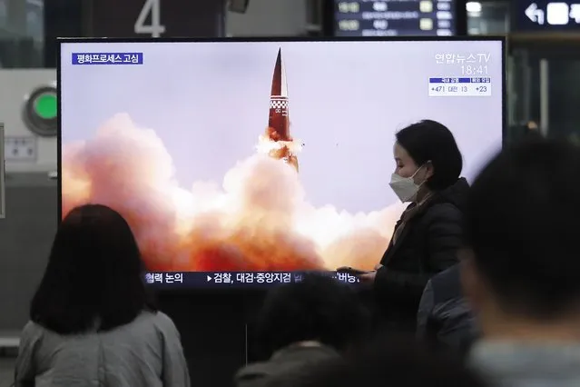 People watch a TV showing an image of North Korea's new guided missile during a news program at the Suseo Railway Station in Seoul, South Korea, Friday. March 26, 2021. In resuming its ballistic testing activity after a yearlong pause, North Korea has demonstrated a potentially nuclear-capable weapon that shows how it continues to expand its military capabilities amid a stalemate in diplomacy with the United States. (Photo by Ahn Young-joon/AP Photo)