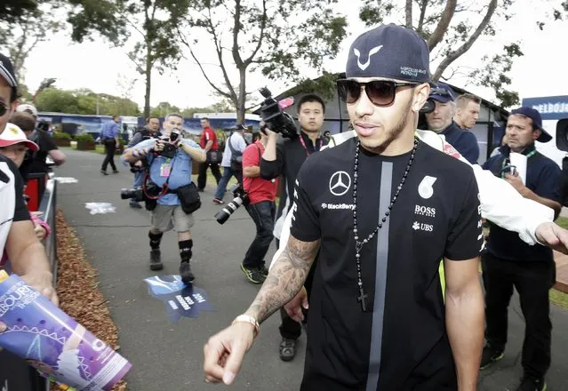 Mercedes Formula One driver Lewis Hamilton of Britain arrives for the first practice session of the Australian F1 Grand Prix at the Albert Park circuit in Melbourne March 13, 2015.   REUTERS/Mark Dadswell