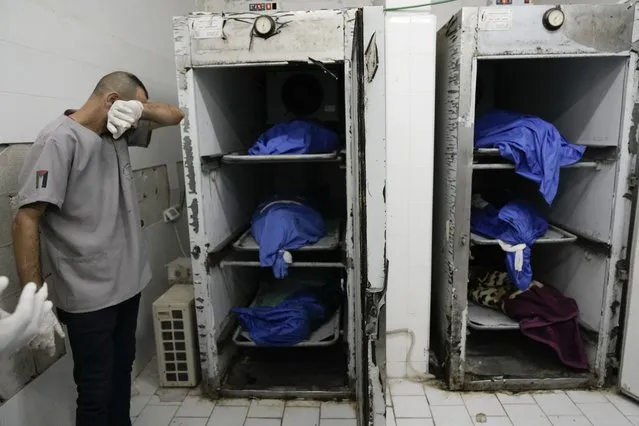 Bodies of Palestinians killed during Israeli army raid on Nur Smas refugee camp are seen in a morgue in Tulkarem, West Bank, Thursday, October 19, 2023. (Photo by Majdi Mohammed/AP Photo)