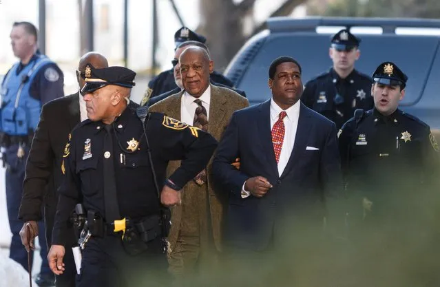 Bill Cosby enters the Montgomery County Courthouse for a court appearance Tuesday, February 2, 2016, in Norristown, Pa. Cosby was arrested and charged with drugging and sexually assaulting a woman at his home in January 2004. (Photo by James Robinson/PennLive.com via AP Photo)