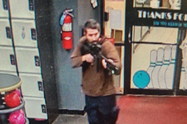 This handout image released on October 25, 2023 by the Androscoggin County Sheriff's Office via Facebook shows a photo of the armed suspect in a shooting as law enforcement in Androscoggin County investigate “two active shooter events” in Lewiston, Maine. At least 10 people were killed and dozens injured in shootings in the city of Lewiston, Maine October 25, 2023 night, US media reported, with police saying that the gunman was still at large. The death toll was reported to be as high as 16 by CNN and the Wall Street Journal, in the shooting spree that took place at a bowling alley and also at least one other location, a local restaurant and bar, according to media. (Photo by Androscoggin County Sheriff's Office/AFP Photo)