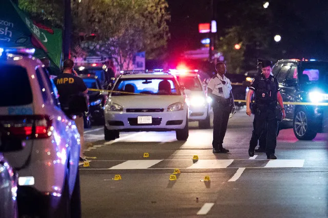 Shell casings dot 14th St NW after a shooting sent diners lining the popular street running for cover in Washington, DC, on July 22, 2021. (Photo by Craig Hudson for The Washington Post)