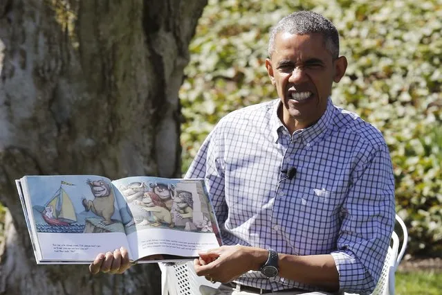 U.S. President Barack Obama acts out a part where the monsters gnash their teeth as he reads the storybook “Where the Wild Things Are” during the annual Easter Egg Roll at the White House in Washington April 6, 2015. (Photo by Jonathan Ernst/Reuters)