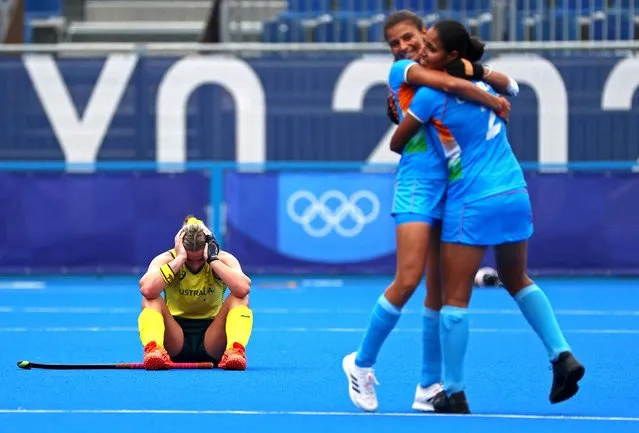 Australia's Mariah Williams sits on the pitch after losing their women's field hockey match against India at the 2020 Summer Olympics, Monday, August 2, 2021, in Tokyo, Japan. (Photo by Kim Hong-Ji/Reuters)