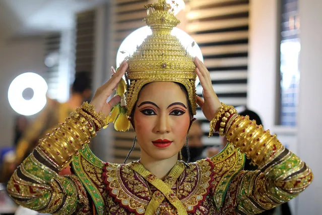 A dancer poses backstage before a performance of masked theatre known as Khon which was recently listed by UNESCO, the United Nations' cultural agency, as an intangible cultural heritage, along with neighbouring Cambodia's version of the dance, known as Lakhon Khol at the Thailand Cultural Centre in Bangkok, Thailand November 7, 2018. (Photo by Jorge Silva/Reuters)