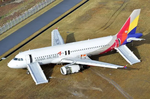 An aerial view shows an Asiana Airlines airplane which ran out of runway after landing at Hiroshima airport in Mihara, Hiroshima prefecture, western Japan, in this photo taken by Kyodo April 15, 2015. (Photo by Reuters/Kyodo)