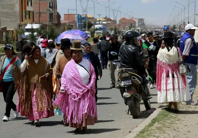 People gather to participate in a parade as the city celebrates the 31st anniversary of its foundation in El Alto, on the outskirts of La Paz March 6, 2016. (Photo by David Mercado/Reuters)